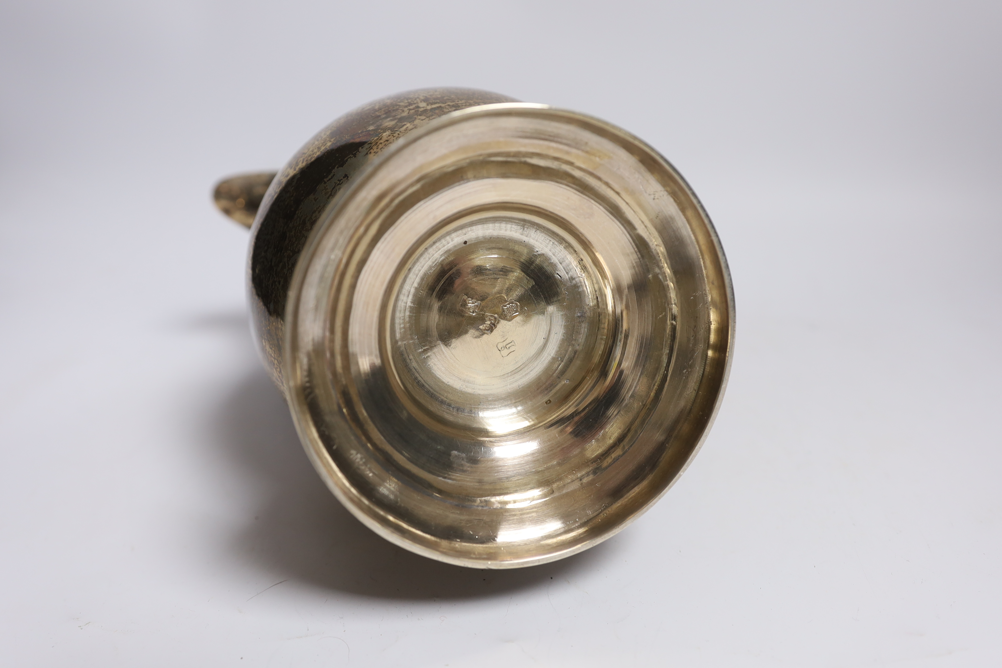 A George II silver baluster ale jug, on pedestal foot, Henry Brind, London, 1744, height 23.5cm, 33oz.